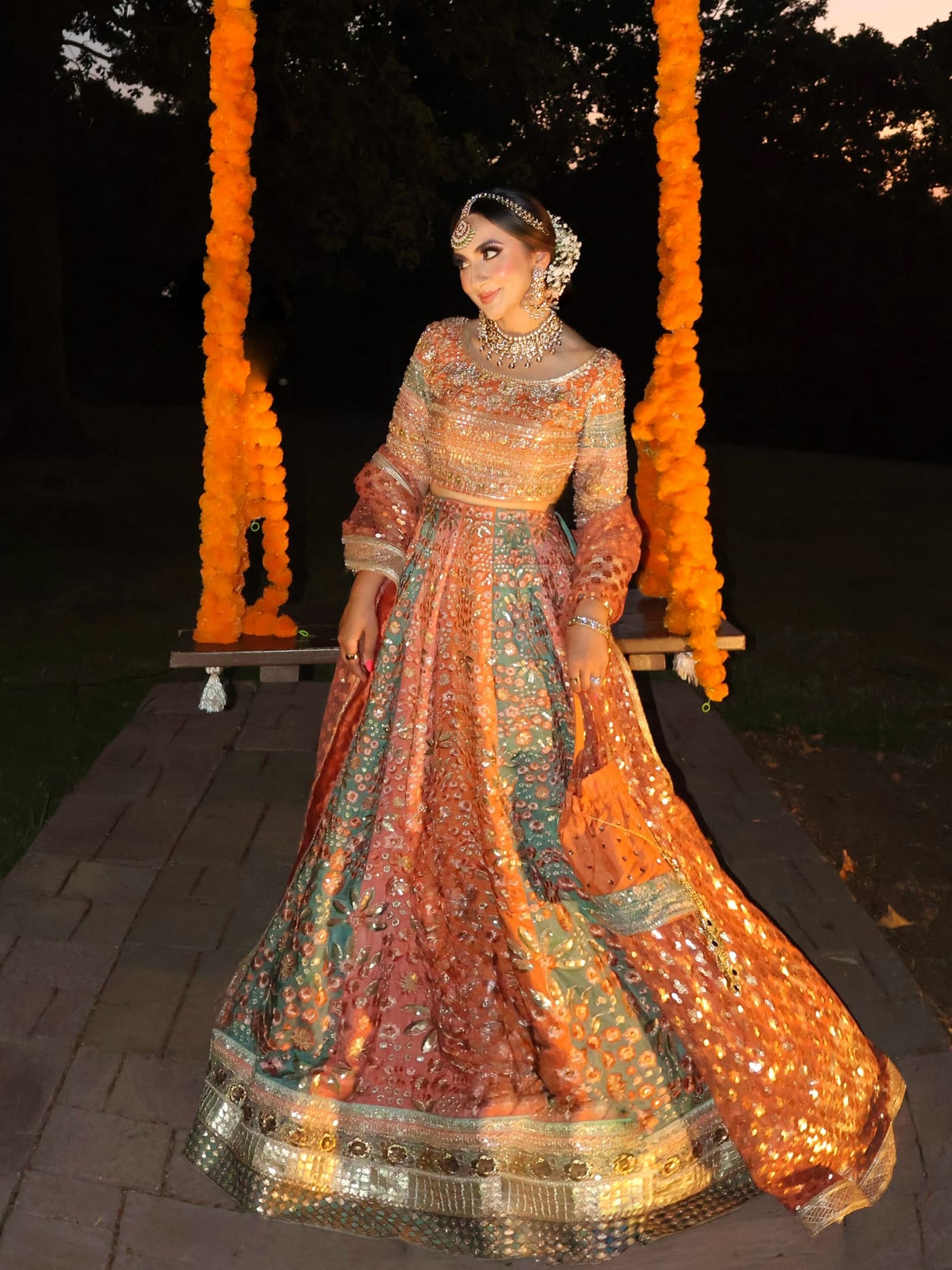 Hand-worked lehnga choli under marigold lights